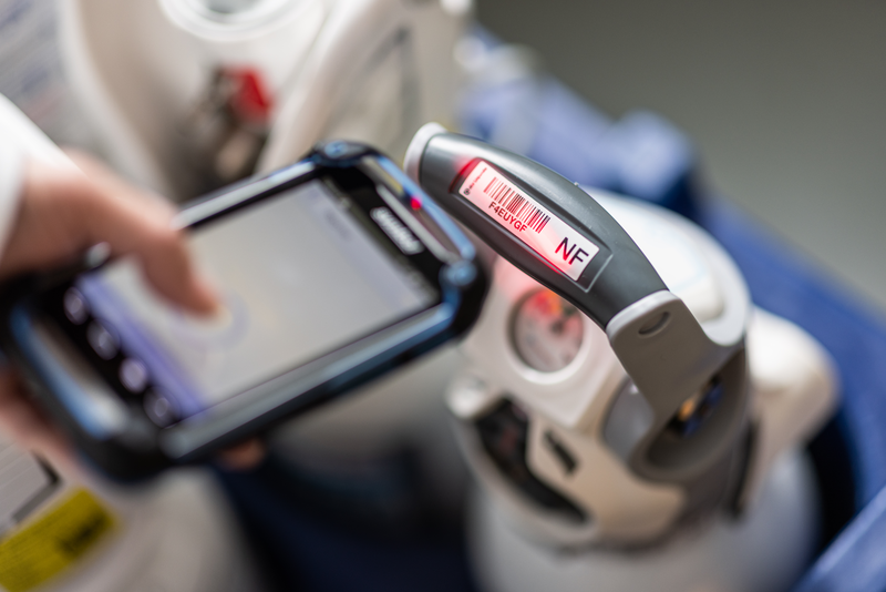Nurse scanning cylinders 5