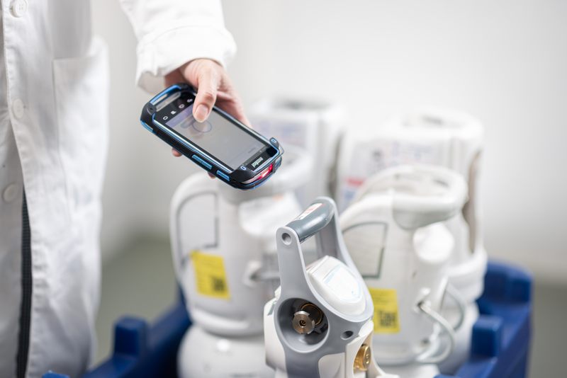 Nurse scanning cylinders 6