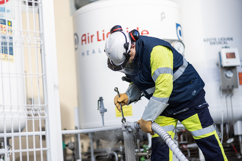 Technician filling a tank 02