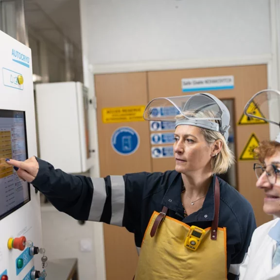 Female technicians facing a biobank control panel 1